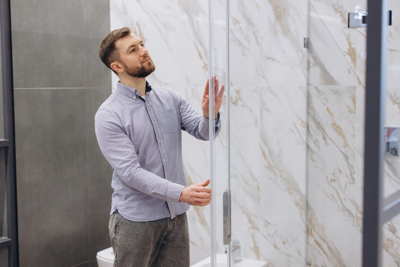 Glass shower door installation in the bathroom in Detroit, MI, & the surrounding area