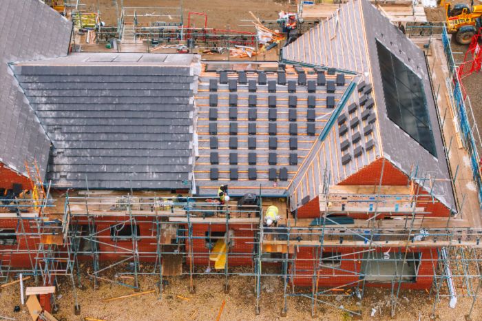 New roof installation on a large home in Detroit, MI, & the surrounding area